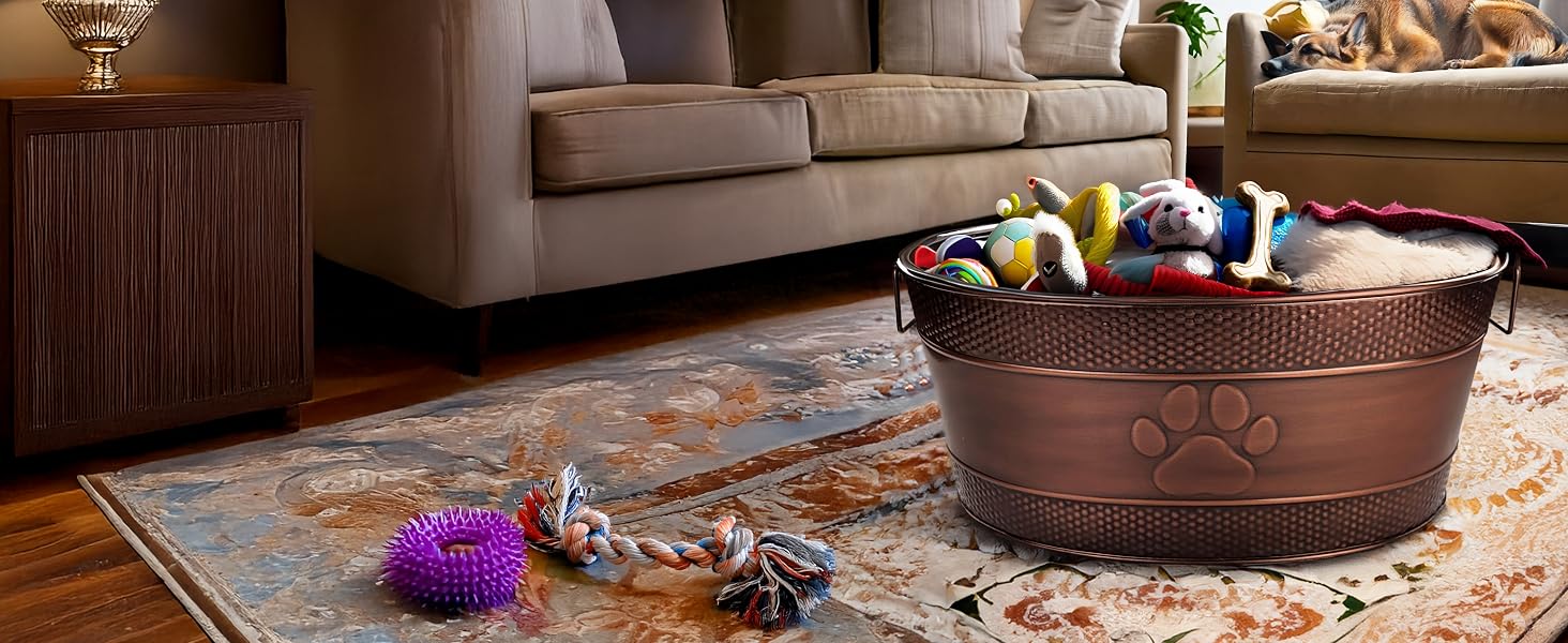 Large indestructible dog toy bin with embossed paw print design, sitting on the floor in a room.