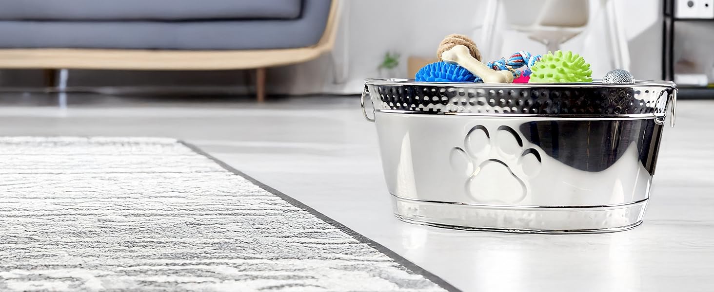 Dog toy basket made of durable stainless steel for aggressive chewers that includes a paw print.
